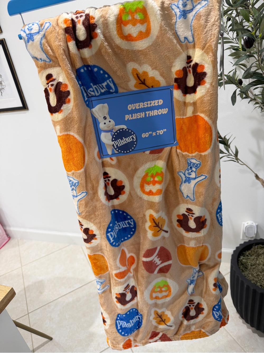 Pillsbury Plush Throw Blanket in Beige with Seasonal Icons